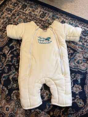 Baby Merlin’s Magic Sleepsuit in Cream